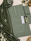An olive green ethnic salwar kameez suit set with intricate silver and turquoise embroidery, featuring a dupatta, kurta, and matching trousers, styled with white flowers on a white textured background.